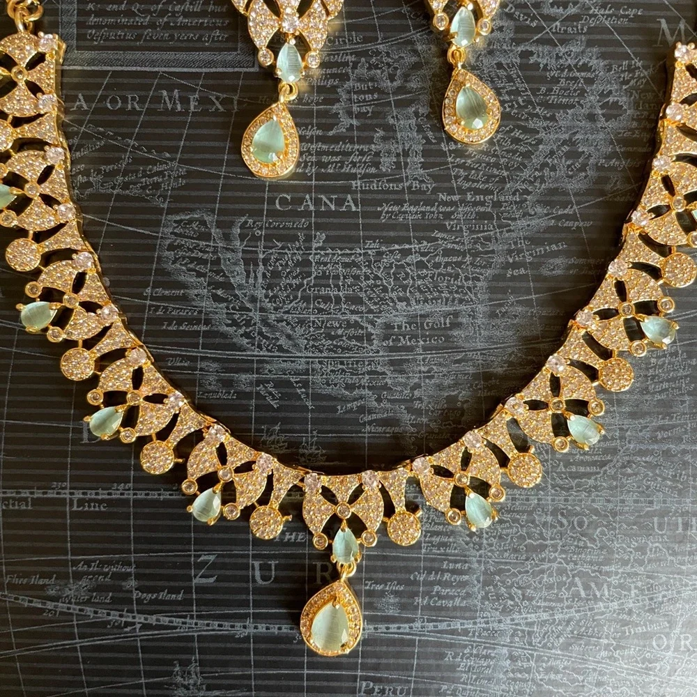 Elegant Gold-Tone Necklace & Drop Earring Set with Pale Green Gem Accents